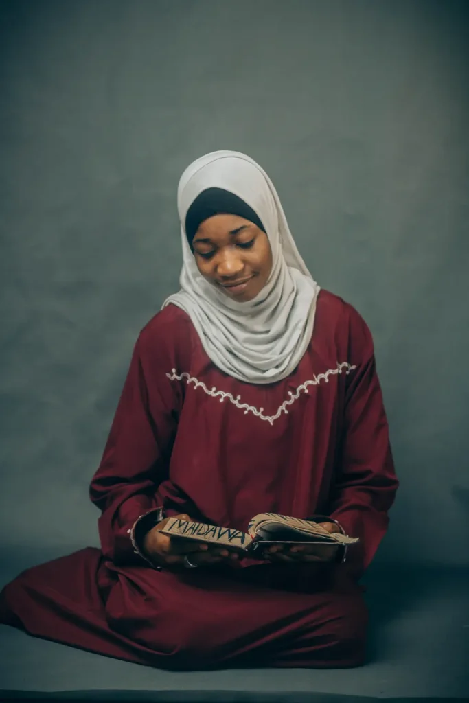 Woman in a hijab reading the Quran